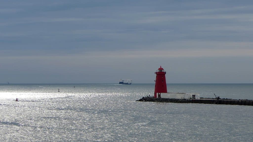 The lighthouse is red in colour to indicate the 'port side' to ships entering Dublin Bay.