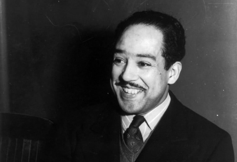 A black and white image of Langston Hughes.