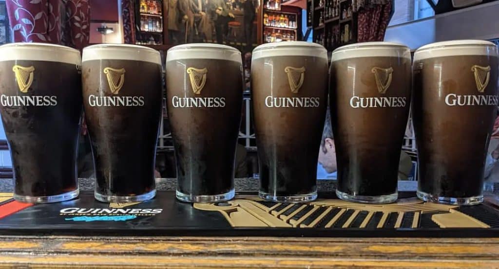 Six pint of Guinness settling on the bar at Bittles.