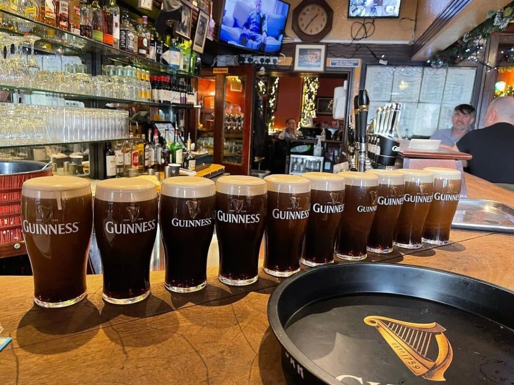A row of pints of Guinness at Mulligans.