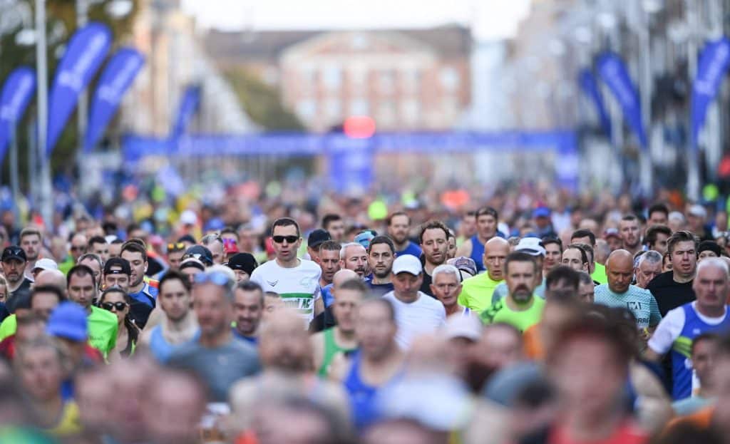 Scores of people run the Dublin City Marathon.