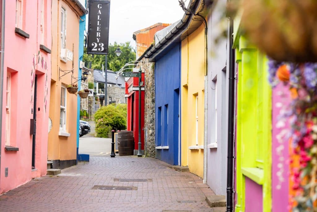 A shot of an empty street in Kinsale highlighting the colourful facades of the town's buildings.