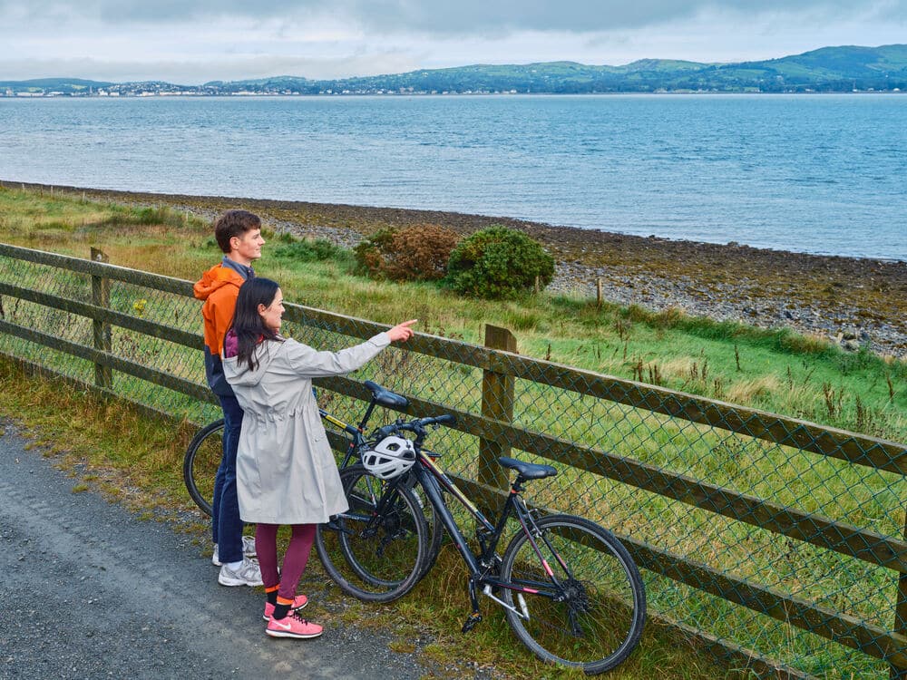 Picture of a couple enjoying the beautiful view of Carlingford Greenway, Co Louth.