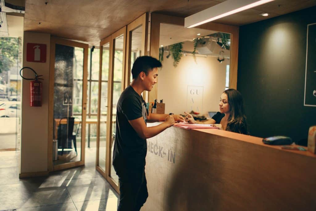 Someone checking into a hotel.