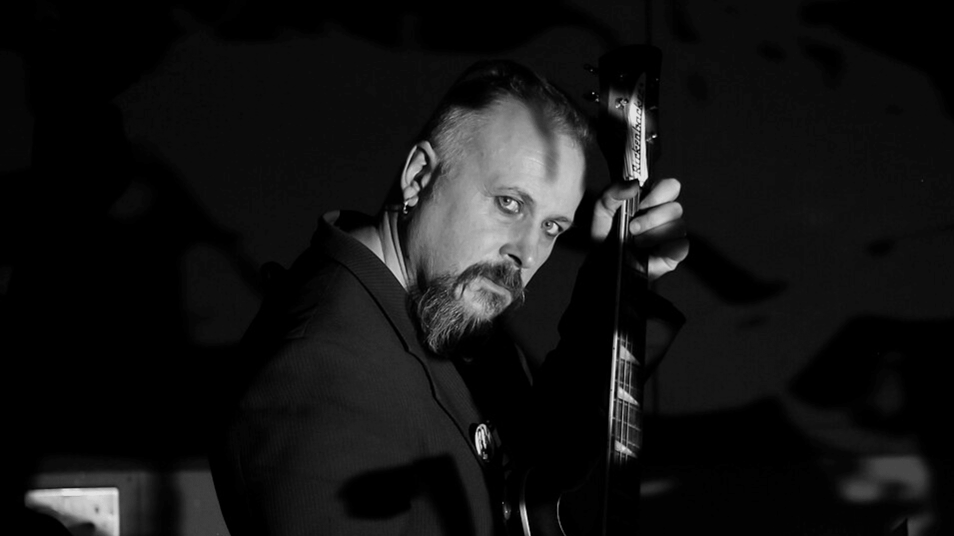 Doctor Millar with guitar.