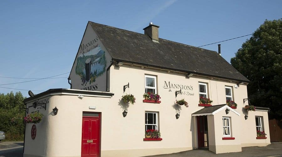 A two-storey traditional Irish pub, Mannion’s Food & Drink, located in New Ross, County Wexford.