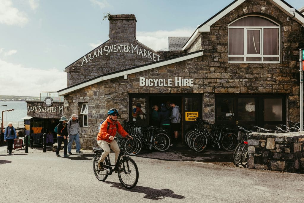 Picture of Aran Sweater Market with people cycling on Aran Islands, County Galway, Ireland